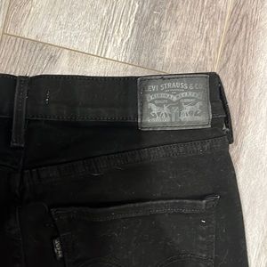 Levi black skinny jeans